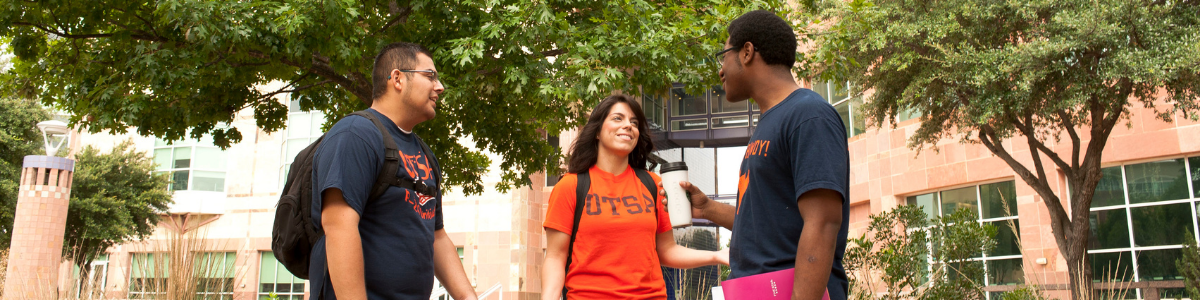 UTSA students chatting on a sunny day on campus