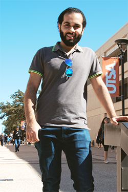 Mahmood smiling and standing on UTSA Campus.