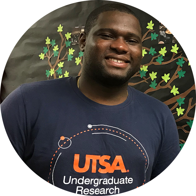 Orcidio smiling and wearing a shirt that reads "UTSA Undergraduate Research"