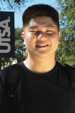 Songyu wearing a backpack and smiling on UTSA's campus