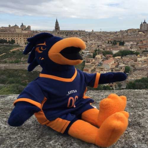 Rowdy plush toy with cityscape background