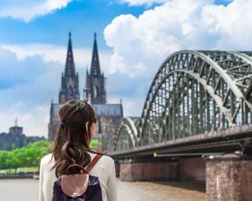 Study Abroad Student looking at a bridge